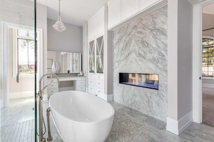 A luxury custom marble fireplace and bathtub installation for Thousand Oaks, California home